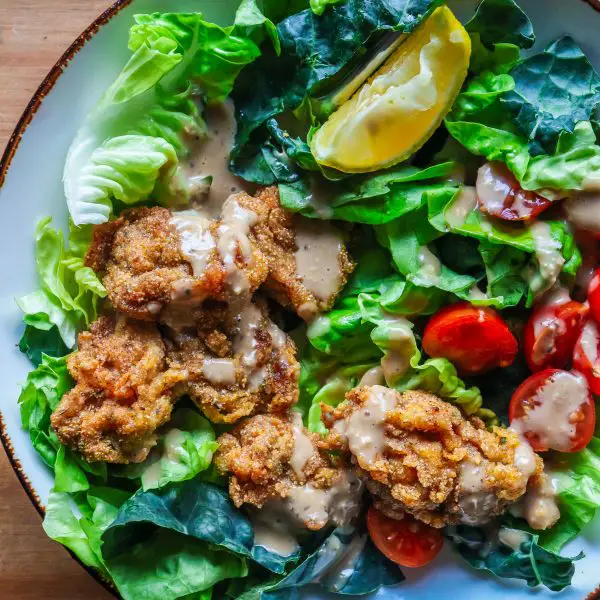 fried oysters over a butter lettuce and tuscan kale salad on www.thedanareneeway.com