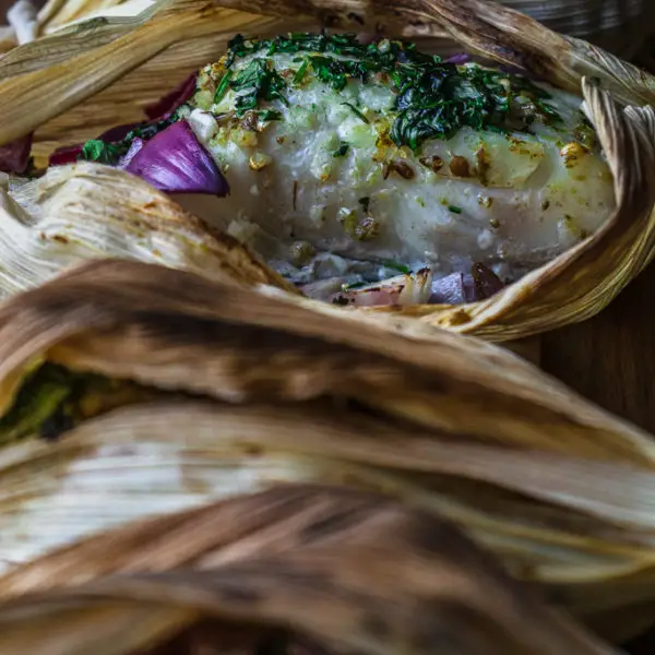 Grilled Halibut in Corn Husks with Spiced Lime Butter on www.thedanareneeway.com